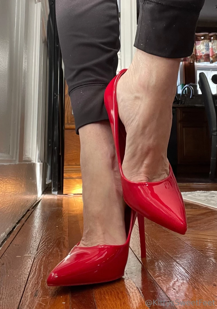 These red stiletto pumps accentuate the natural elegance of my 