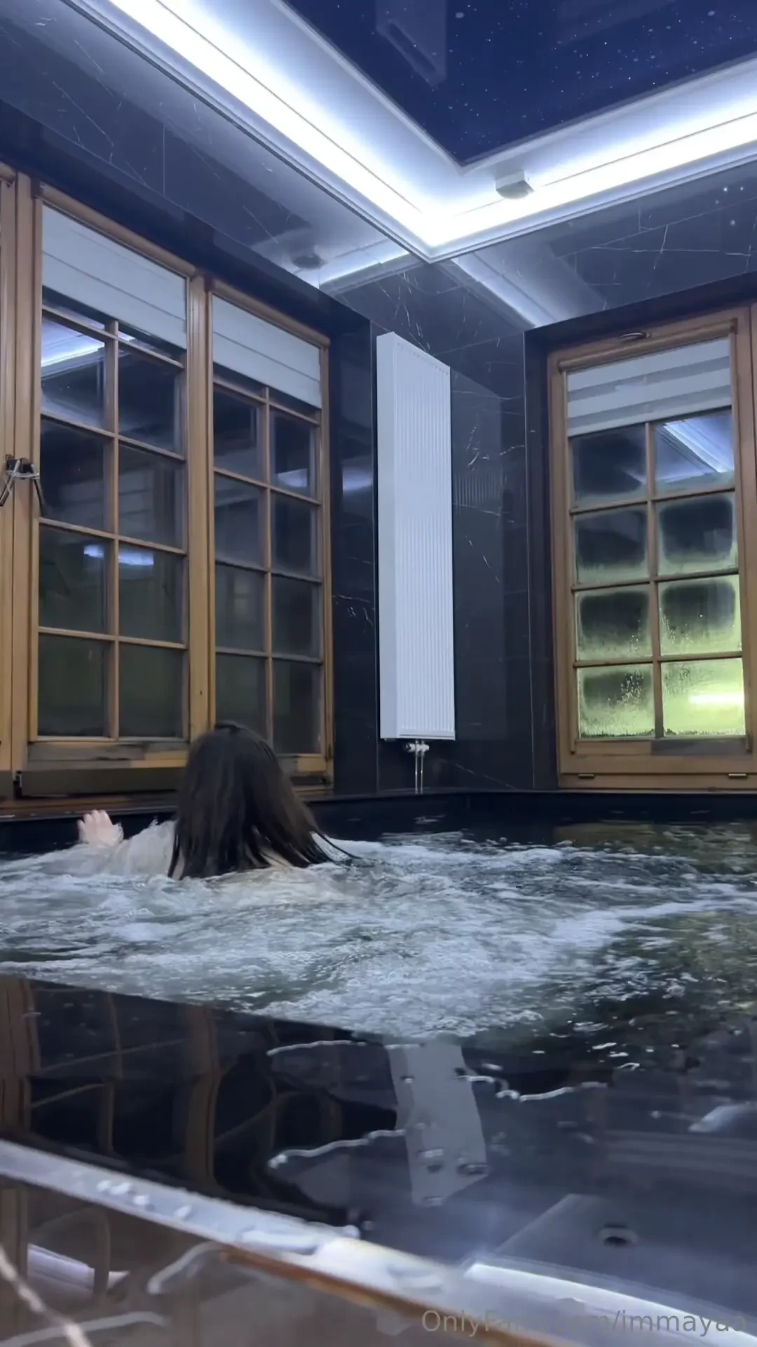 Sitting in the hot tub covered in warmth and feeling all the 