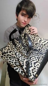 Which purse do you think i look better in the first or the second i part 1