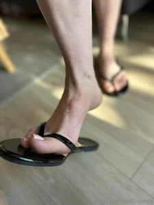 Fresh pedi in my shiny black flip flops