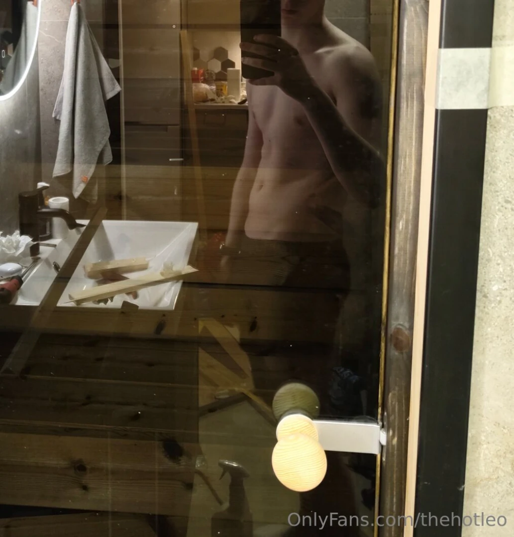 The reflection of the new sauna door shows my sexy body and renovation 