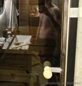 The reflection of the new sauna door shows my sexy body and renovation