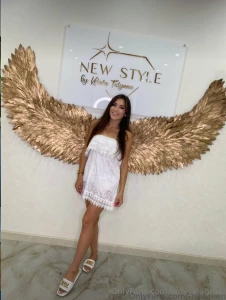 I love this photo my beautiful tan and white dress with bright wings