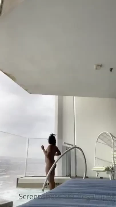 Sparking up naked on the penthouse balcony 