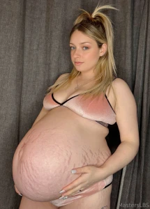 How much bigger can this huge belly get cum tell me in my messages