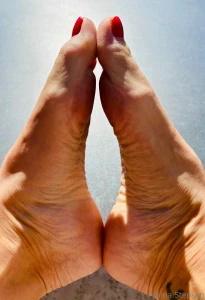 Feet soles wrinkled sun