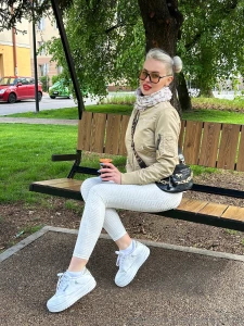 Sitting on a bench catching the rays of sun and enjoying the light