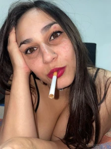 You stare at more than my cigarette you look at my eyes my lips my