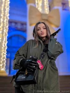 Walks around the winter city everywhere everything is lit up and in a