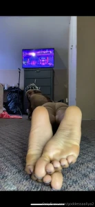 One minute of me laying on my stomach showing soles