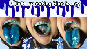 Close up eating blue honey my teeth mouth and uvula in close up and