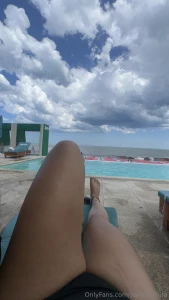 Enjoying a day at the pool in front of the beach while i tan