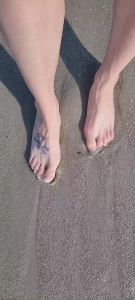 Full length of toes in the sand