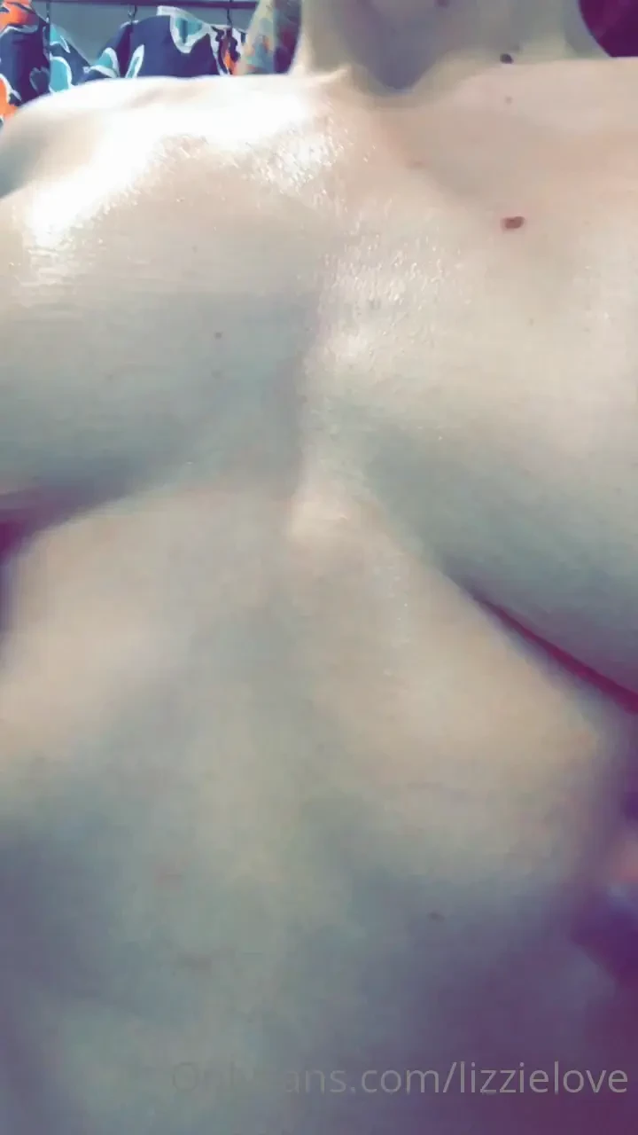 Rubbing oil all over my tits after a steamy shower 