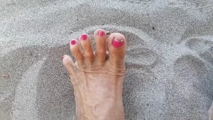 Sexy feet in the sand