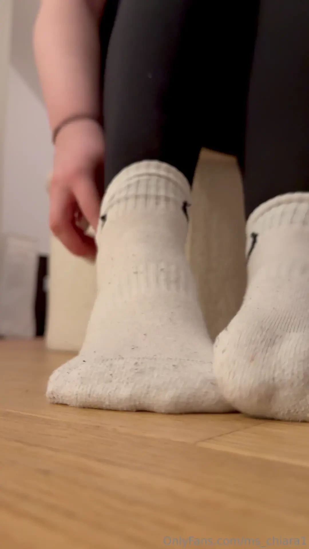 I slowly take off my damp sports socks the sweat-soaked fabric 