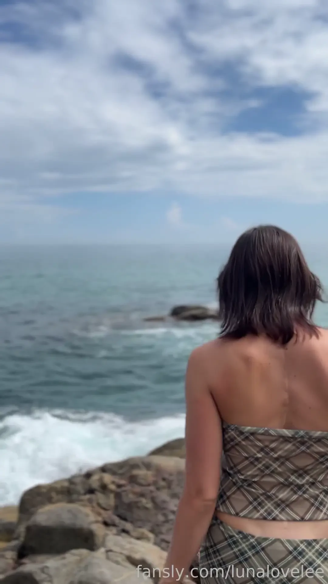 Reflecting on the endless ocean waves feeling the caress of the salty 