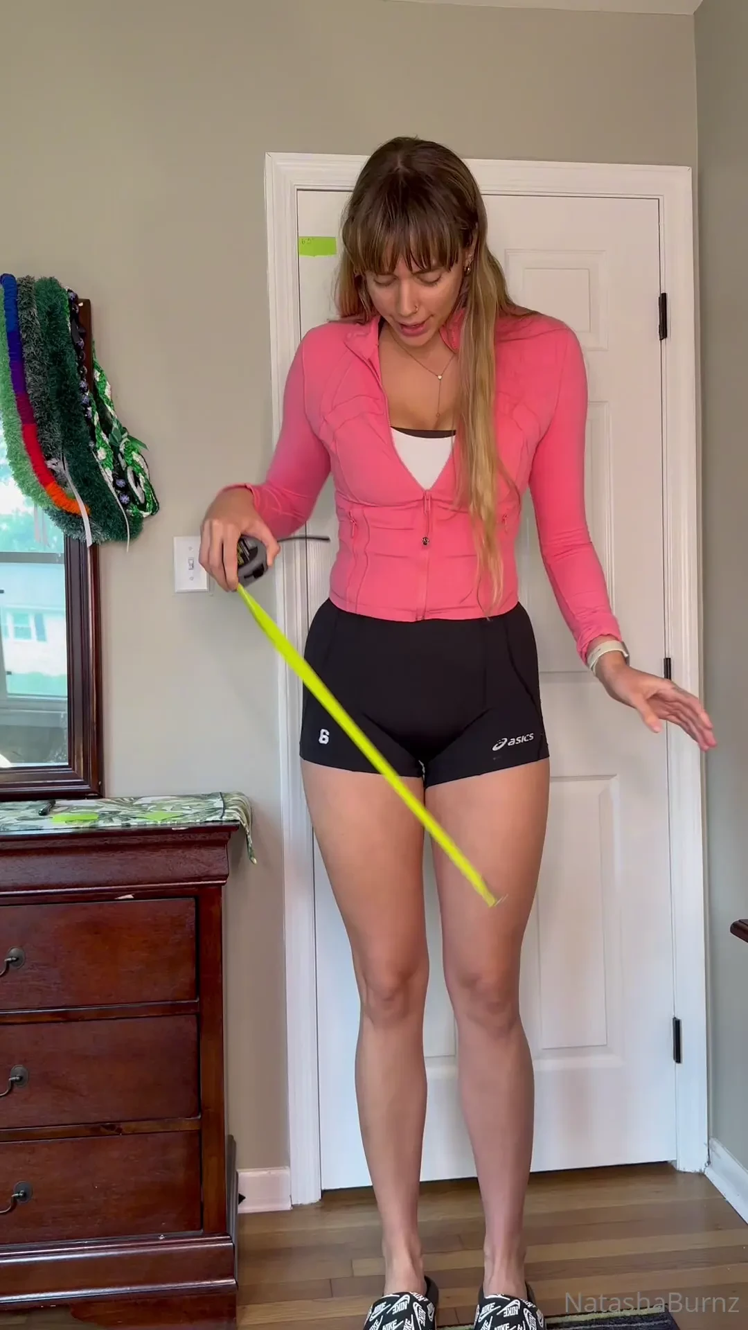 Comparing my height in a pair of slide then with a set of high heels 