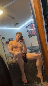 Catching the flex in the mirror biceps pumped abs tight and this hard