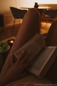 An evening a book a candle and a little coziness between the lines