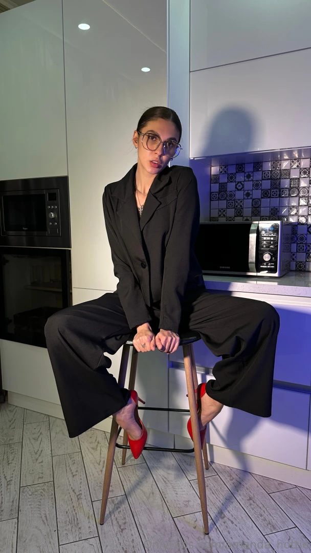 I won t ask you twice red heels sharp jacket tight slacks glasses 