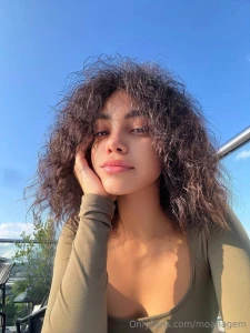 Sitting outside sunlight warming my face no makeup as natural and