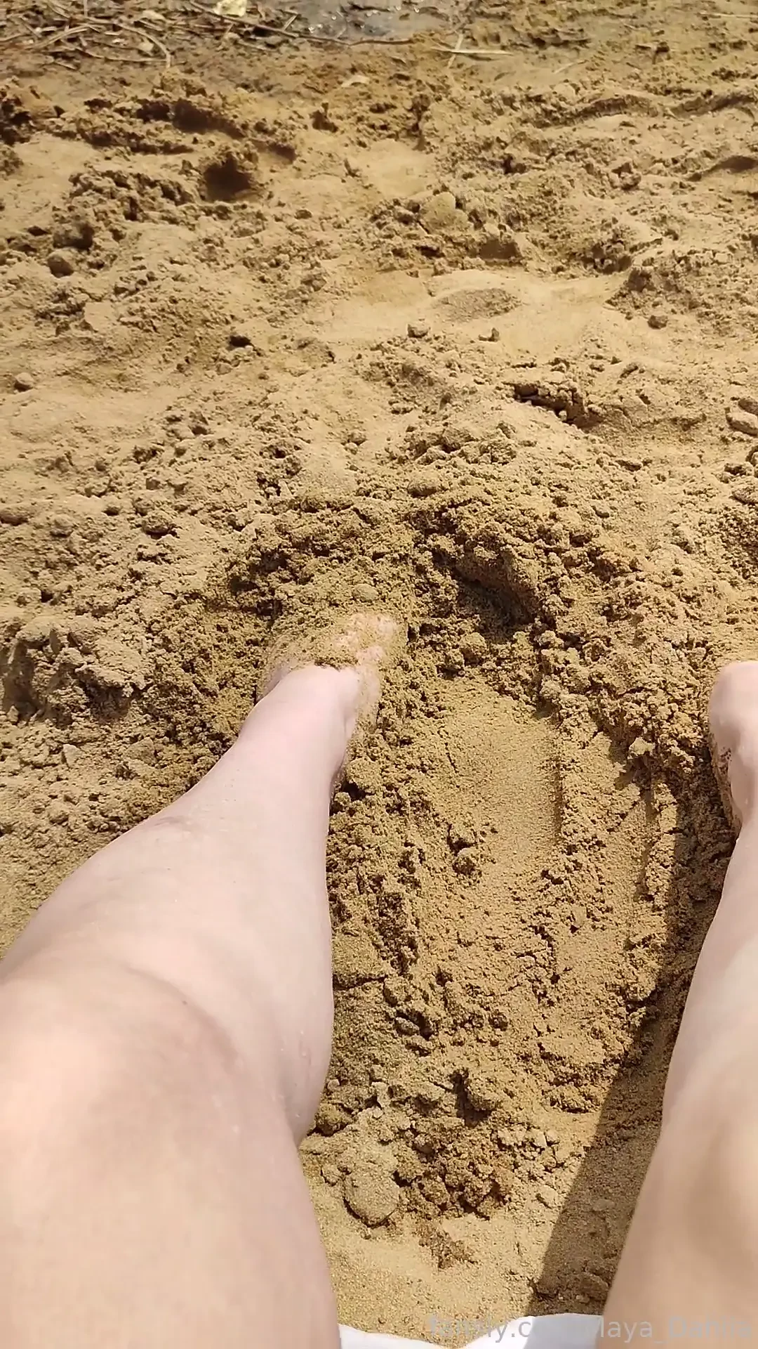 Just warming my feet in the hot sand 
