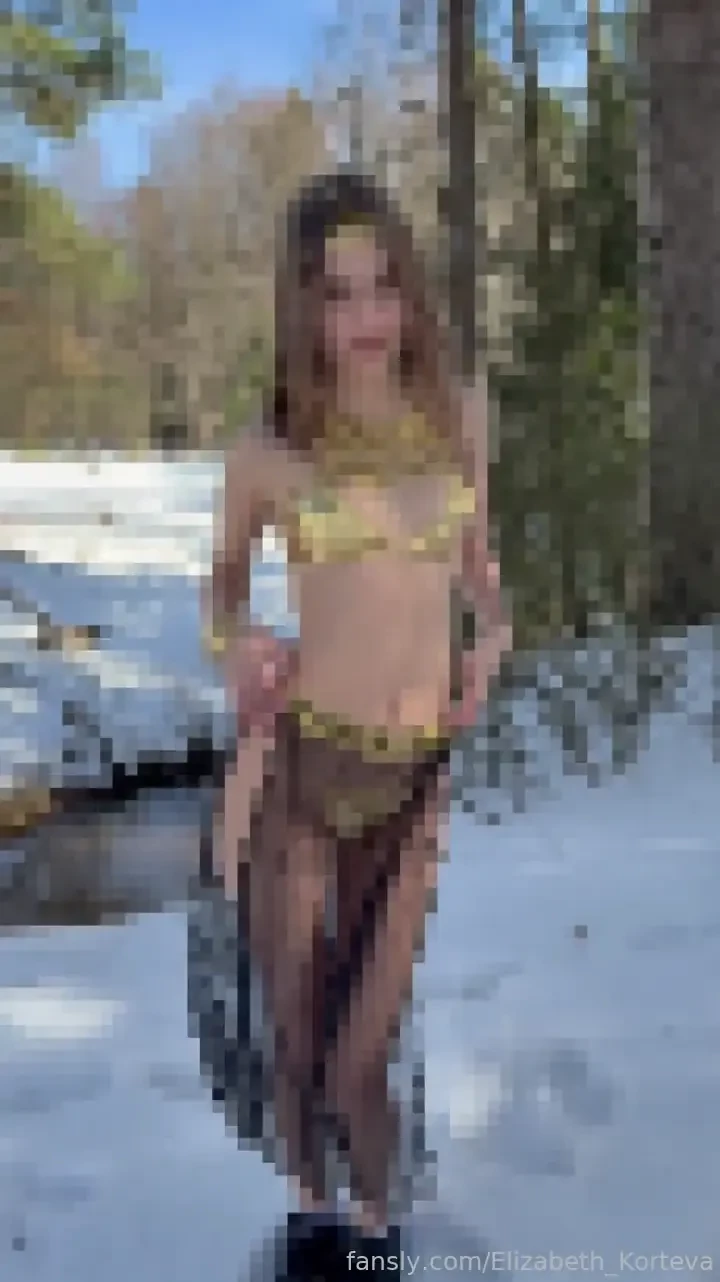 Shahirizada saw snow got very excited and started touching her pink 