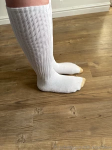 Huge size 18s in calf length socks measured against ruler in multiple part 2