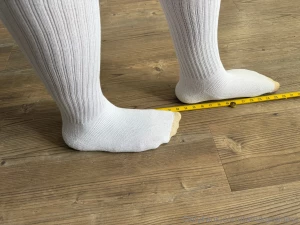 Huge size 18s in calf length socks measured against ruler in multiple