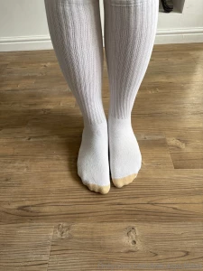 Huge size 18s in calf length socks measured against ruler in multiple part 1