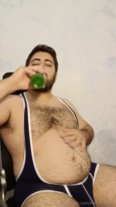 Chugging beer in singlet