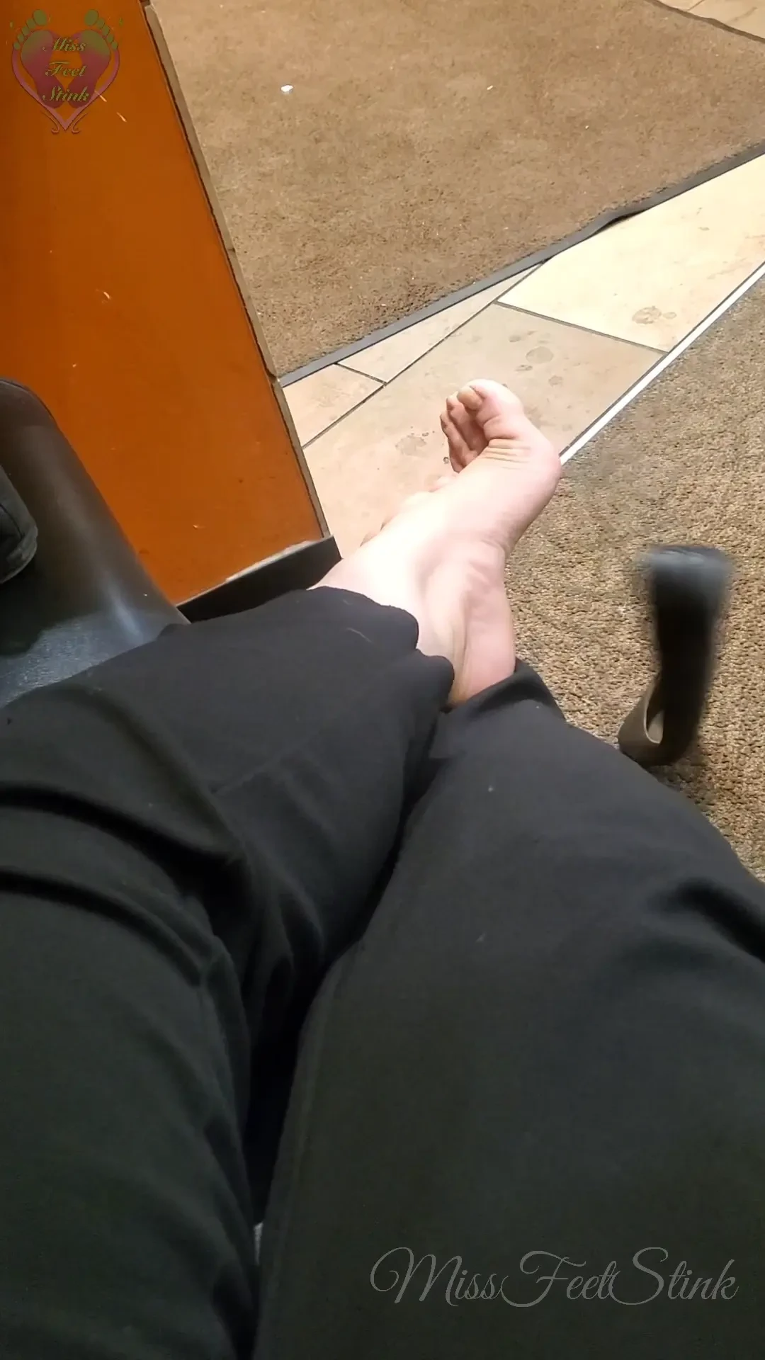In public at my local coffee shop black flats stinky feet shoe play 