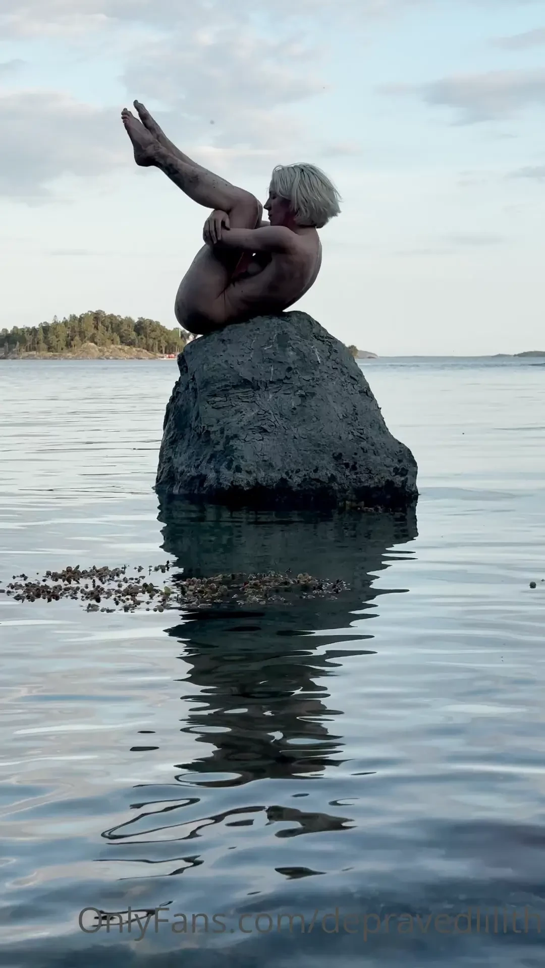 Naked on a rock one with it 