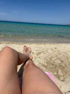 Warm sand on my feet and turquoise water in the background is part 2