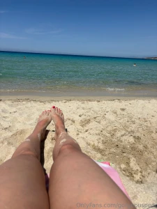 Warm sand on my feet and turquoise water in the background is