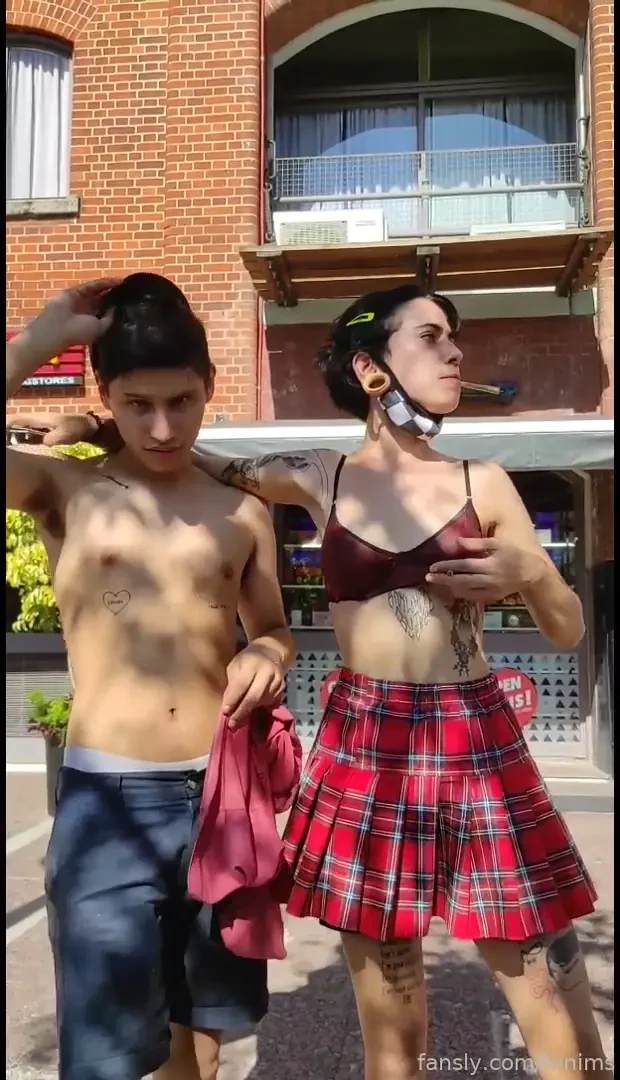 Flashing in the city in front of cars in the road 