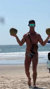 Rocking my thong swimsuit at the beach and grabbing a fresh coconut part 1