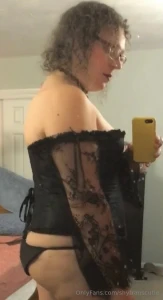 A video and 5 photos of me in a black corset and new black and red part 1