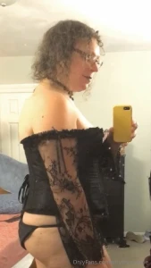 A video and 5 photos of me in a black corset and new black and red