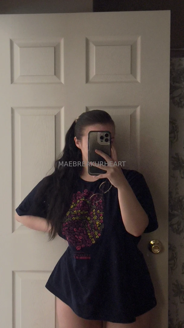 Mae in a big t-shirt and tiny tong 