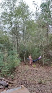 Standing out in the wintertime woods undressing and waggling about