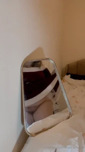 Mrs claus feeling cute and being caught in the mirror