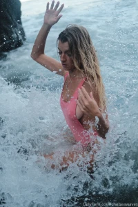 She s riding the waves while chasing the horizon