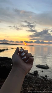 Fingers kissed by sea breeze nails catching sunlight now tell me are