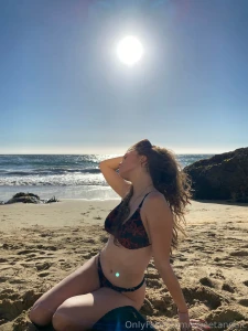 A blond girl on the beach go to our chat for more