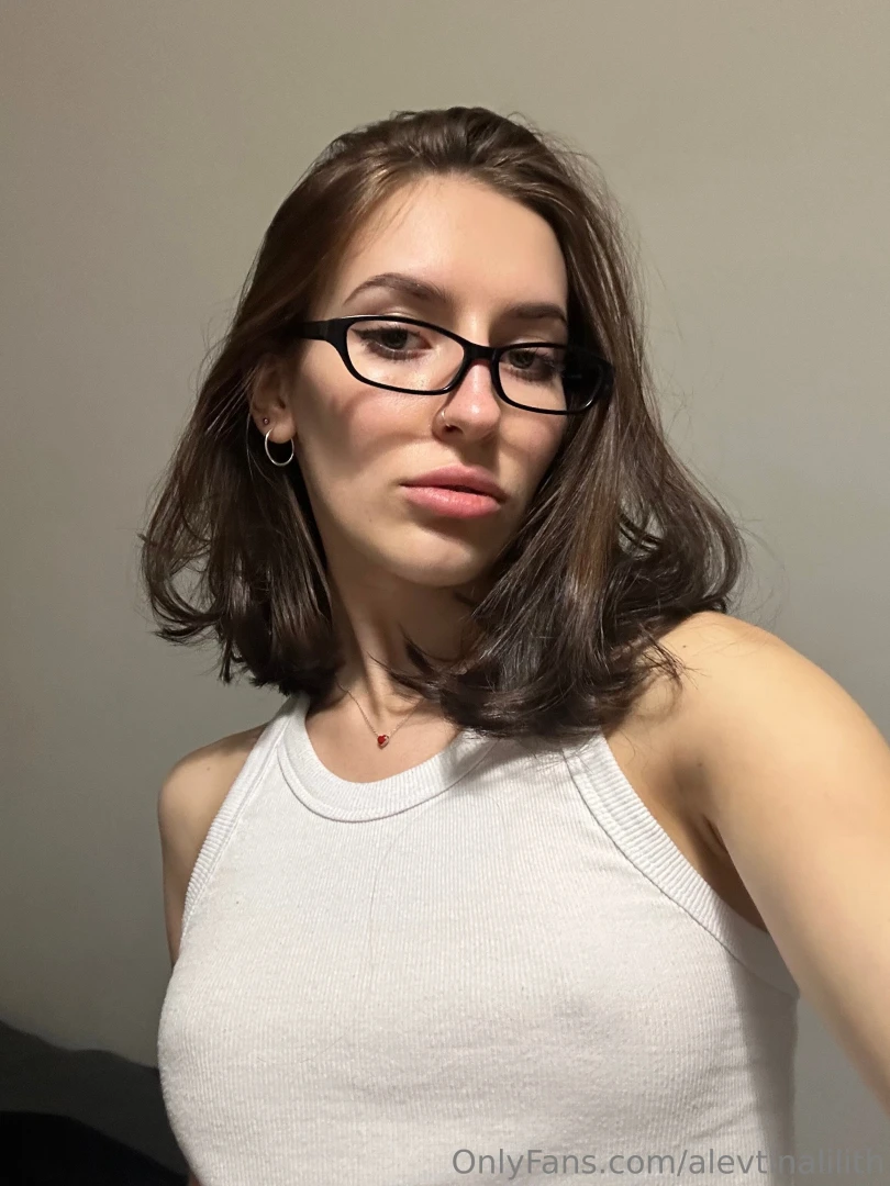 The white t-shirt subtly hints but the darkness ignites the 