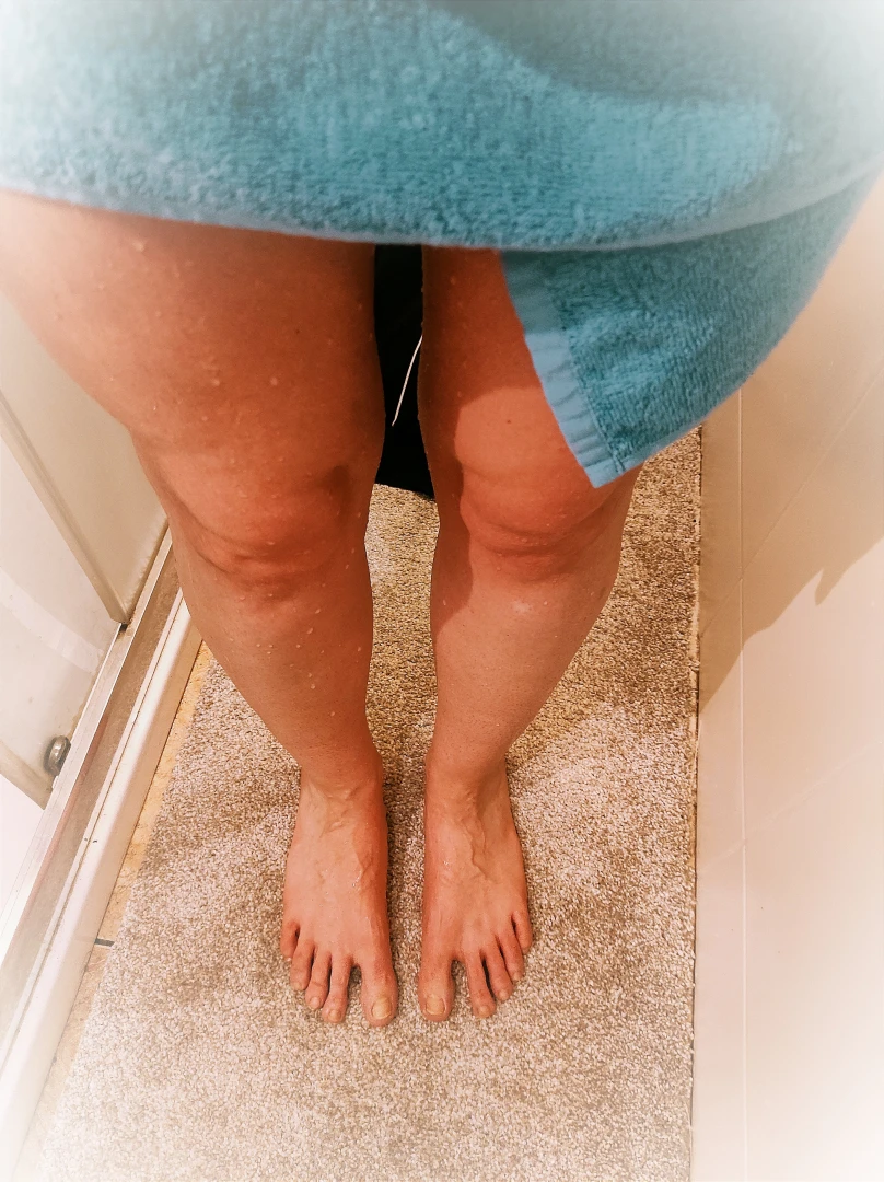 Just stepped out of the shower the water still clings to my skin 