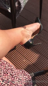Drinks in the sun in black patent louboutin iriza