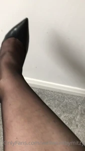 Black sheer nylons and black stilettos